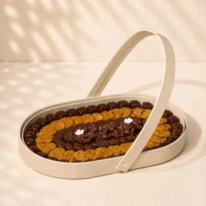 Luxury oval chocolate gift tray with premium handcrafted Belgian assorted chocolates in an elegant reusable gift tray for same-day delivery in Dubai.