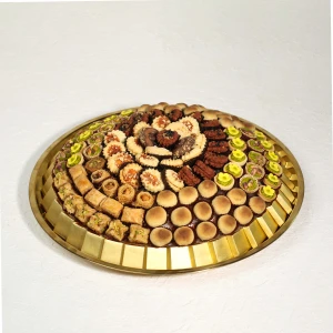 Eid Special Arabic Sweets Mix Tray with baklava, maamoul and pistachio sweets in gold tray Dubai
