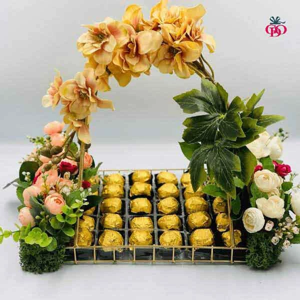 chocolate gift basket with artifical flowers decorations