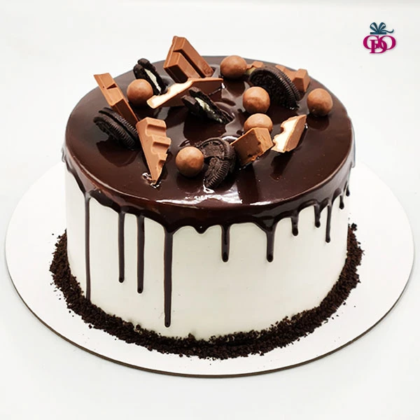 Chocolate Flavour Cake and juicy chocolate sponge arranged with branded and quality chocolates on top.