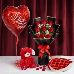 Luxury red roses bouquet with teddy bear, heart love balloon and heart-shaped chocolate box