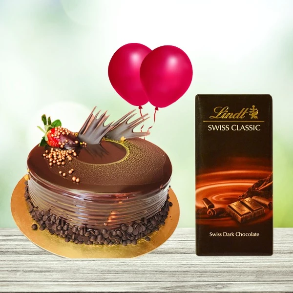 Half kg Chocolate Cake Decorated Cherries and Chocolate arranged on top with 1 Lindt chocolate and 2 HBD Helium balloons