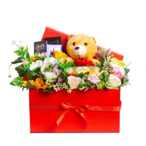 1 Small teddy bear,3 Pcs Lindt chocolate bars, 1 Fererro rocher chocolate box and Arranged with assorted artificial flowers